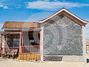 Sunny view of the Tom Kellys Bottle House
