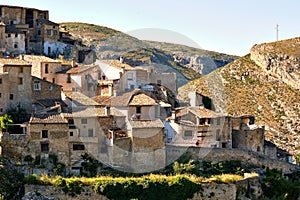 During sunny warm day view to the old obsolete rural houses of Bocairent hillside village placed in north west of Mariola mountain
