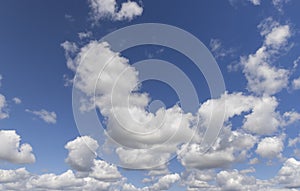 sunny weather with white clouds on a blue sky background