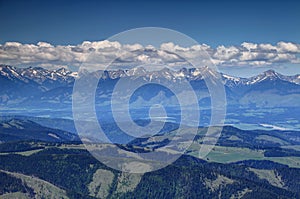 Sunny Western Tatras peaks with white clouds in Liptov Slovakia