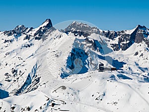 Sunny winter day in alpine ski resort