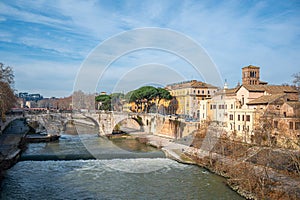 Sunny winter day in Rome, featuring the small Tiber Island and Ponte Cestio
