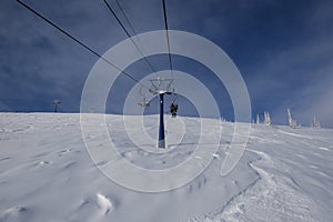 sunny winter morning in the mountains of sheregesh on the ski track