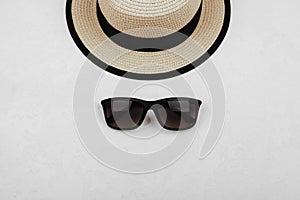 Sunprotection objects sunglasses and hat.