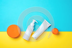 Sunprotection objects, suscreen. Flat lay, natural cosmetics, cream SPF for face and body. Summer Travel Concept photo