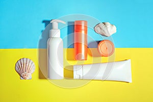 Sunprotection objects, suscreen. Flat lay, natural cosmetics, cream SPF for face and body Summer Travel Vacation Concept photo