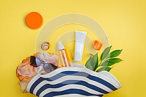 Sunprotection, sanscreen. Beach set: hat, sun glasses and protection cream SPF Beach accessories. Summer Travel Concept photo