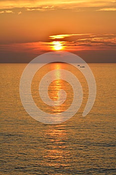 Sunraise and cloud on sea