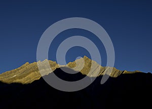 Sunrays over himalayan peak in Pinvalley, Spiti Valley, Himachal Pradesh, India