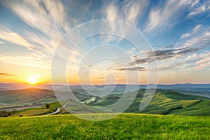 Sunrice in a rolling hill landscape