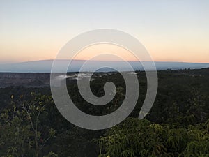 Sunrise above Halemaâ€™umaâ€™u Crater and Mauna Loa at Hawaii Volcanoes National Park on Big Island, Hawaii.