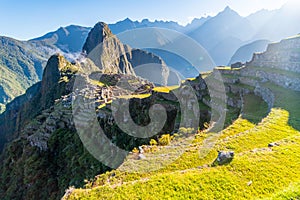 Sunrise above Inca ruins of Machu Picchu archeological site, Cusco, Peru, South America