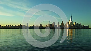 Sunrise above Manhattan, New York, NY - View across Hudson River from Pier A Park in Hoboken, NJ.