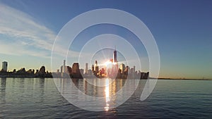 Sunrise above Manhattan, New York, NY - View across Hudson River from Pier A Park in Hoboken, NJ.