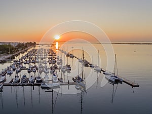 Sunrise aerial seascape view of Olhao Marina, waterfront to Ria Formosa natural park.
