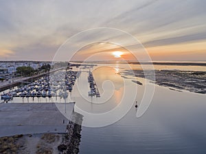 Sunrise aerial seascape view of Olhao Marina, waterfront to Ria Formosa natural park.