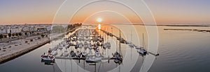 Sunrise aerial seascape view of Olhao salt marsh Inlet, waterfront to Ria Formosa natural park. Algarve.