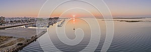 Sunrise aerial seascape view of Olhao salt marsh Inlet, waterfront to Ria Formosa natural park. Algarve.