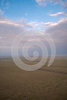 Sunrise aerial view of the Masaai Mara Reserve in Kenya Africa. Vast, desolate landscape