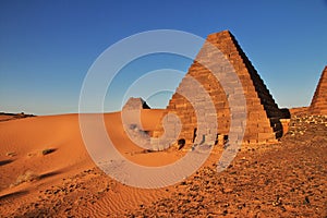 The sunrise, the ancient pyramids of Meroe in Sahara desert, Sudan