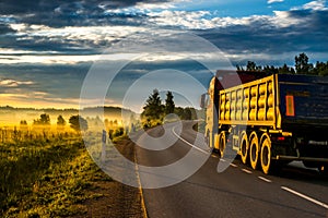 Sunrise and asphalt road,