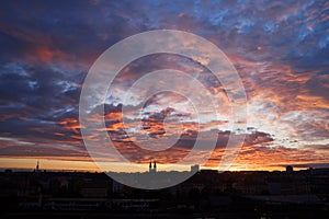 Sunrise on the background of the city panorama on the horizon. Sunrise at Prague.