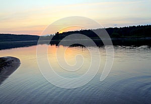 Sunrise on the background of the river. Forest landscape. Foggy haze. Bright orange and blue colors. Stock photography with empty