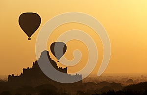 Sunrise balloons over Bagan.