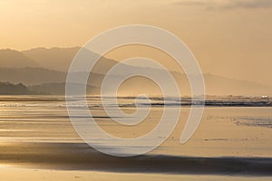 Sunrise on the beach of Matapalo in Costa Rica photo