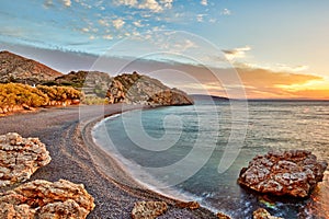 Sunrise at the beach Mavra Volia in Chios, Greece