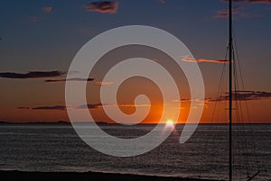 Sunrise on the beach with two catamarans stranded on the shore in Mojacar Almeria