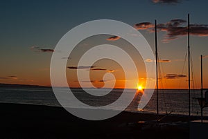 Sunrise on the beach with two catamarans stranded on the shore in Mojacar Almeria