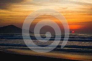 Sunrise in a beach of Ubatuba, Sao Paulo, Brazil