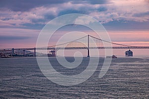 Sunrise Behind the 25 de Abril Bridge in Lisbon, Portugal