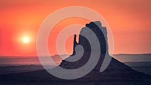 Sunrise behind the East Mitten, Monument Valley