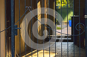 Sunrise behind fence on street