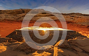 Sunrise behind Mesa Arch in Canyonlands National Park, Utah