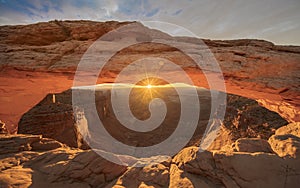 Sunrise behind Mesa Arch in Canyonlands National Park, Utah