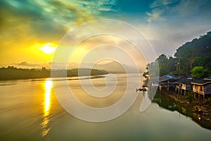 Sunrise behind the mountain and river