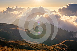 sunrise behind mountains with sea of fog in sembalun of Mt.Rinjani area