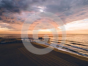 Sunrise at Belmar Beach with heavy clouds from above