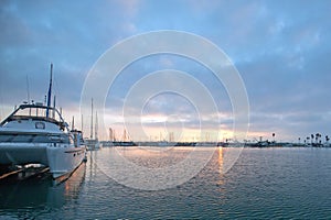 Sunrise boat reflections over Channel Islands harbor at Oxnard on the gold coast of California United States