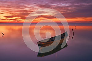 sunrise with boats on the lake in the Danube Delta 4