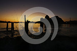Sunrise on Botafogo beach next to Sugarloaf Mountain, traditional postcard of Brazil photo