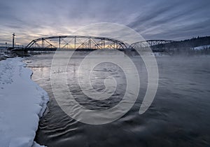 Sunrise on the Bow River and a Steel Truss Bridge in Cochrane