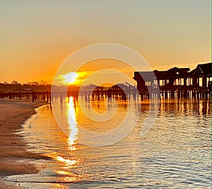 Sunrise broken pier Adirondack chairs The grand Lodge Marriott signature hotel point clear Fairhope Alabama