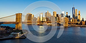 Sunrise on the Brooklyn Bridge and the skyscrapers of Lower Manhattan. New York City