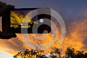 A sunrise through a camera of a cellular phone