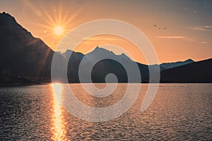 Sunrise on Canadian rockies with colorful sky on Medicine Lake at Jasper national park