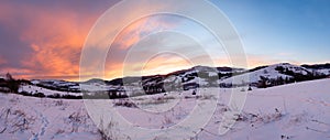 Sunrise Carpathian mountain winter panorama.